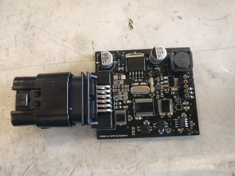 One of the custom driverless boards, with its vehicle-harness connector